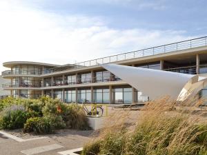 an external view of a building with a white building at Sea View in Hastings