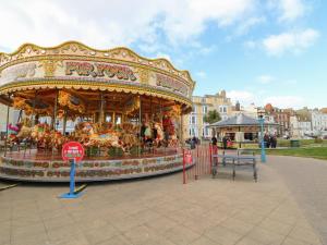 a merry go round carousel in a park at Louisa Cottage in Weymouth