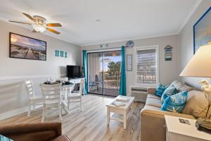 a living room with a couch and a table at Ocean Dunes Villas Coligny Beach 43 S Forest Beach Dr, Hilton Head SC #111 Heated Pool Ocean View By Vacation Rental HHI LLC in Hilton Head Island