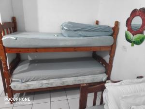 En eller flere senge i et værelse på Casa perto da praia, Maitinga