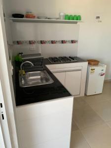 Kuchyň nebo kuchyňský kout v ubytování Aloha Beach SAI