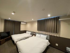 Uma cama ou camas num quarto em Le Studio 五条高倉