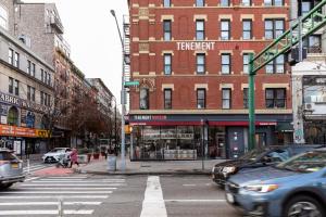 a busy city street with cars and a building at Kasa Lantern Lower East Side in New York