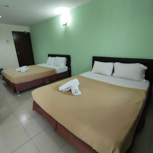 Postel nebo postele na pokoji v ubytování Best One Hotel