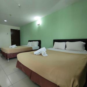 Postel nebo postele na pokoji v ubytování Best One Hotel