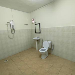 a bathroom with a toilet and a sink at Best One Hotel in Malacca