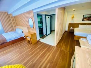 Postel nebo postele na pokoji v ubytování Beautiful Sapa Hotel