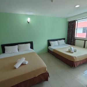 Postel nebo postele na pokoji v ubytování Best One Hotel