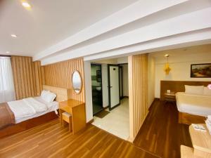 Postel nebo postele na pokoji v ubytování Beautiful Sapa Hotel
