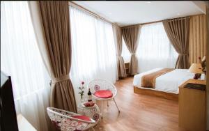 Postel nebo postele na pokoji v ubytování Beautiful Sapa Hotel
