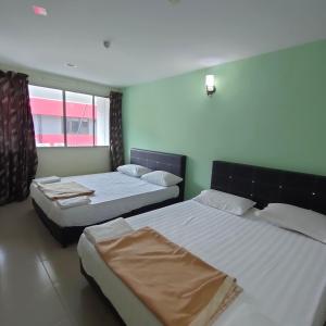 Postel nebo postele na pokoji v ubytování Best One Hotel