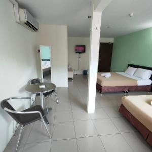 Postel nebo postele na pokoji v ubytování Best One Hotel