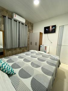 Ένα ή περισσότερα κρεβάτια σε δωμάτιο στο Conchas de Maragogi +31 φωτογραφίες