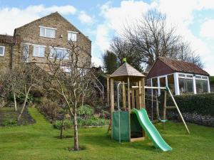 a playground with a slide and a gazebo at Castle View in Wykeham