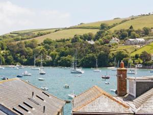 a group of boats floating on a body of water at Retreat Cottage in Salcombe