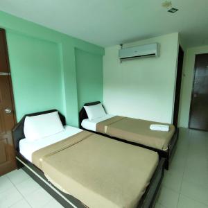 Postel nebo postele na pokoji v ubytování Best One Hotel