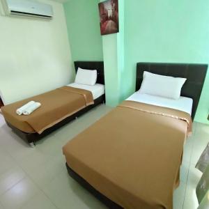 Postel nebo postele na pokoji v ubytování Best One Hotel