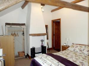 a bedroom with a bed in a room at Lord Mayors Barn in Alston