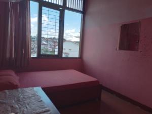 Tempat tidur dalam kamar di Wisma Galiharum Banjarnegara