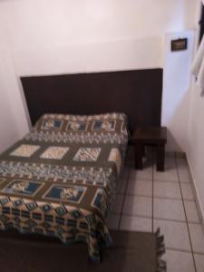 Een bed of bedden in een kamer bij HoSkal Xilitla, Departamento 2 Habitaciones