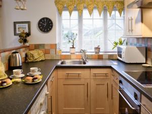 a kitchen with a sink and a counter top at Stowford Linhay - E3138 in Lewdown