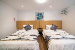 Postelja oz. postelje v sobi nastanitve Manantial Hostal No.004