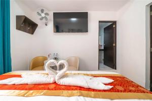 Postelja oz. postelje v sobi nastanitve Manantial Hostal No.004