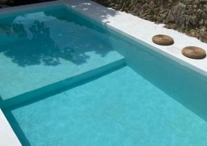 The swimming pool at or close to Masía La Costereta