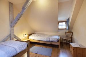 Ένα ή περισσότερα κρεβάτια σε δωμάτιο στο Maison en duplex
