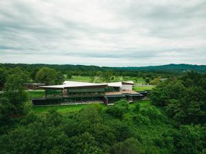 an aerial view of a building in the middle of trees at SNOW PEAK FIELD SUITE SPA HEADQUARTERS 