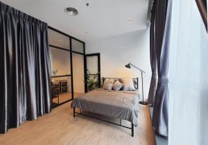 a bedroom with a bed and a large window at Bangsar Trade Centre Kuala Lumpur by SkyLimit Suites in Kuala Lumpur