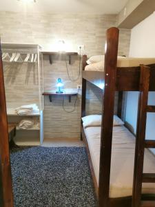 a bunk bed room with two bunk beds in it at Casa Vacanza Pescocostanzo in Pescocostanzo