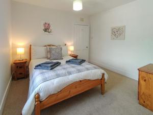 Llit o llits en una habitació de Brow Cottage - UK5512