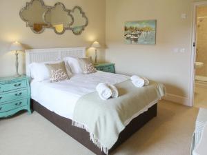 Tweedmouth Cottage tesisinde bir odada yatak veya yataklar