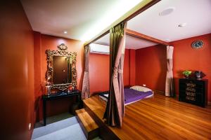 Ein Bett oder Betten in einem Zimmer der Unterkunft Explorar Koh Samui - Adults Only Resort and Spa