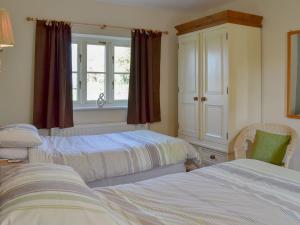 Posteľ alebo postele v izbe v ubytovaní Watermill Cottage