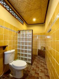 a bathroom with a toilet and a shower at Paradise Palms in Ko Chang