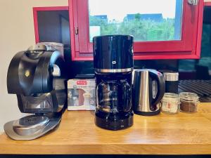 a coffee maker sitting on top of a counter at Le loti des Arnats in Saint-Nectaire