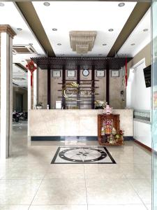 a lobby of a hotel with a reception desk at MILAND HOTEL in Can Tho +23 photos
