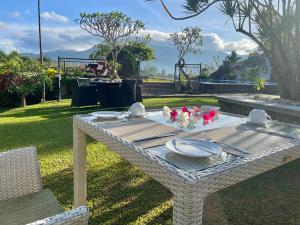 a picnic table with plates and dishes on it at Elegant Hotel in Kandy