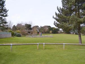 a park with a playground in the middle of a field at Seacroft in Cromer