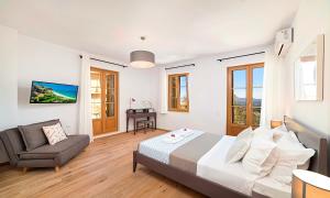 Postel nebo postele na pokoji v ubytování Sun Stone Villas