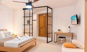 Postel nebo postele na pokoji v ubytování Sun Stone Villas