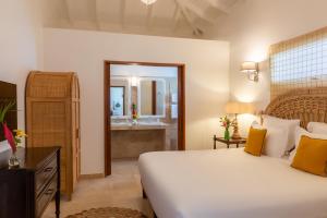 Un ou plusieurs lits dans un hébergement de l'établissement Habitation Saint Charles - Hôtel de Charme & Spa