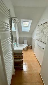 a bathroom with a sink and a toilet at Port de Pornic. Vue mer. Sea view. 4 rooms. in Pornic