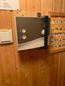 a safe on the wall of a room at Bärenhütte in Turracher Hohe