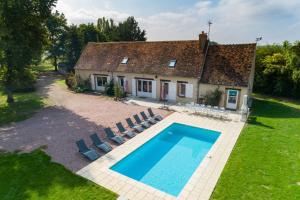 an external view of a house with a swimming pool at So Villa Ramenerie 45 - Heated pool - Basket - 1h30 from Paris - 26 beds in Courtemaux