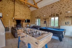 a large room with a pool table in the middle at Crazy Villa Chateaubert 28 - Heated pool - Basket - 2h Paris - 30p in La Chapelle-Saint-Fray