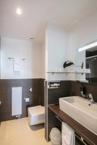 Koupelna v ubytování Hôtel Prealpina