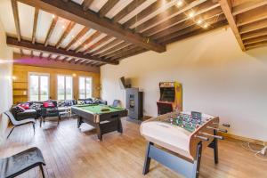 a living room with a pool table and a game room at Crazy Villa Radar 89 - Heated pool - Multisports field - 2h Paris - 30p in Saint-Cyr-les-Colons